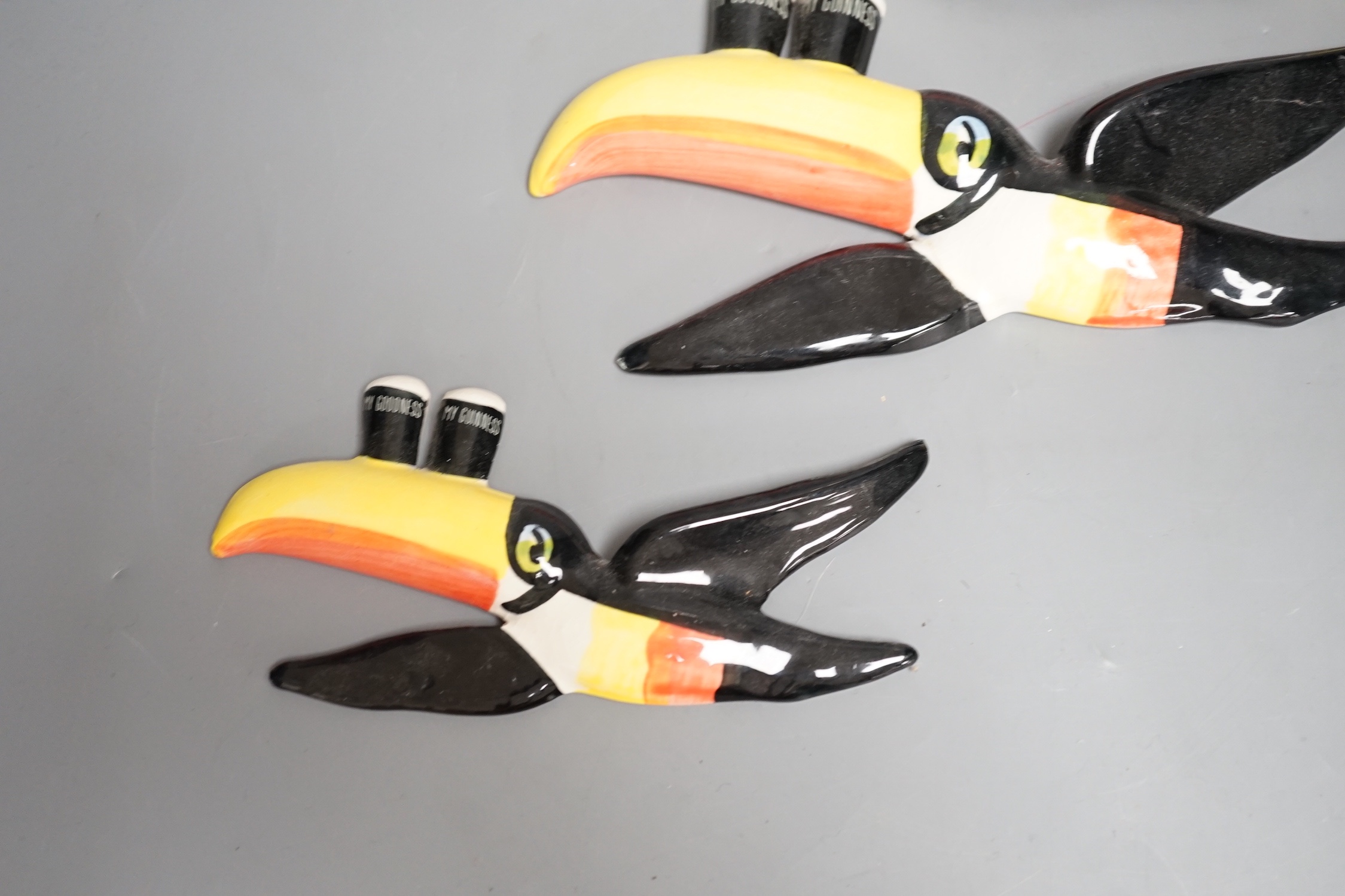 A graduated set of three Carlton ware toucan wall plaques